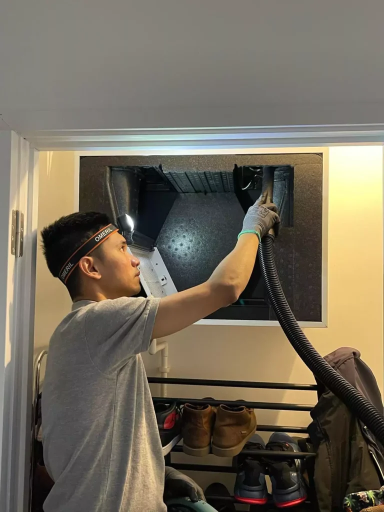 Cool Runnings Technician Cleaning Out Ventilation System