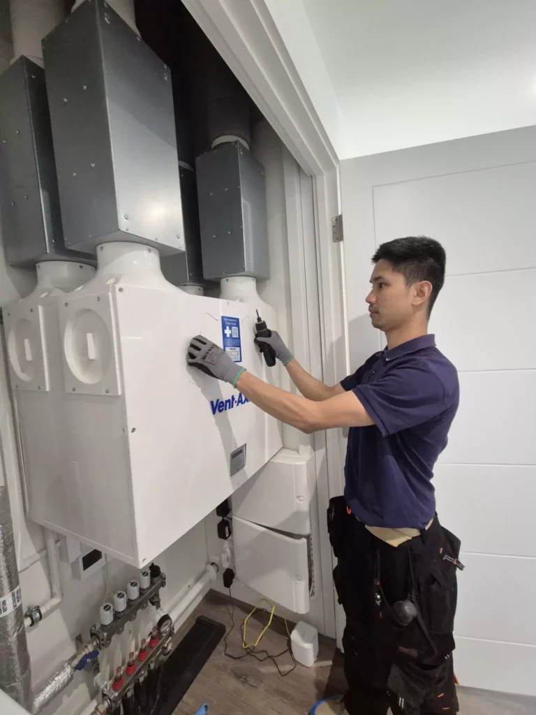 Technician Examining an MVHR System